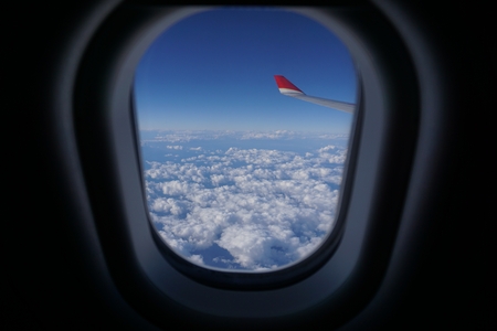 blue sky with clouds from the airplane window
