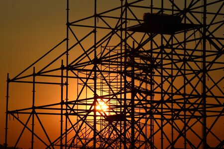 silhouette of construction site scaffolding