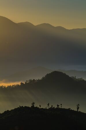 A view from mountains to the valley with lightの写真素材