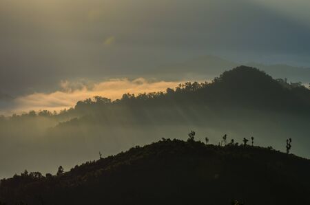 A view from mountains to the valley with lightの写真素材