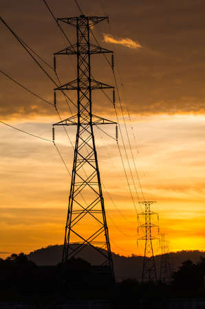 Electrical tower with sunrise viewの写真素材