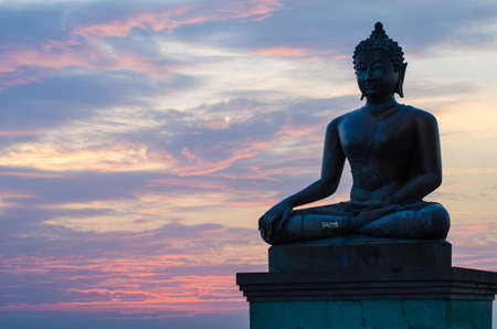 Buddha statue with sunsetの写真素材