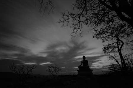 Buddha statue with sunsetの写真素材