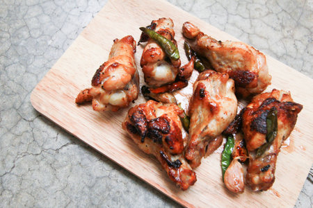 fried chicken with garlic and chilli on trencherの写真素材