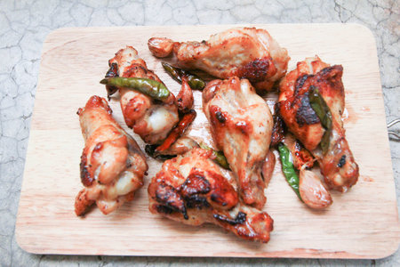 fried chicken with garlic and chilli on trencherの写真素材