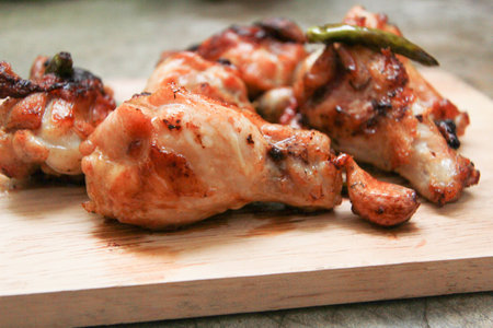 fried chicken with garlic and chilli on trencherの写真素材