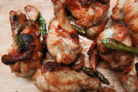 fried chicken with garlic and chilli on trencherの写真素材