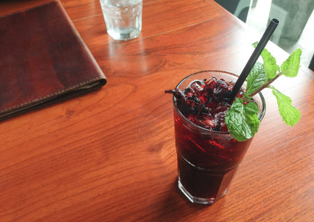 Fresh roselle juice (healthy drink) on Wooden deskの写真素材
