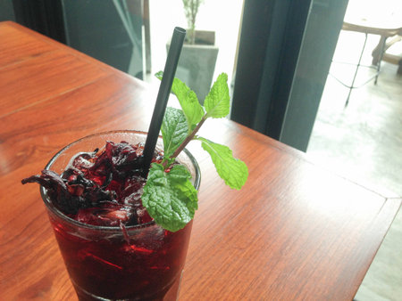 Fresh roselle juice (healthy drink) on Wooden deskの写真素材