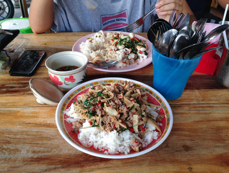 Fried basil leave with pork and bamboo shoot on riceの写真素材