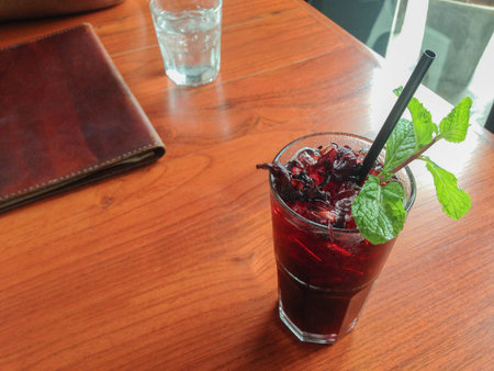 Fresh roselle juice (healthy drink) on Wooden deskの写真素材
