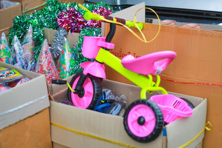 Tricycle - child pedal wheel cycling bicycle toy on a box in marketの写真素材