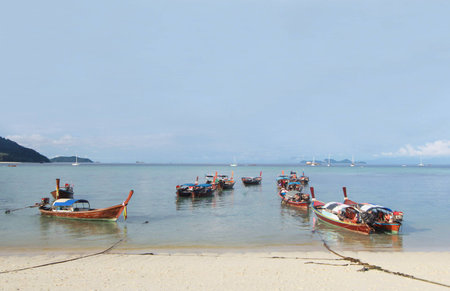 Longtail boat and beautiful ocean with blue sky of Koh Lipe island, Thailandの写真素材
