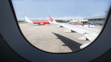 viwe window air plane of Parked aircraft on Hat Yai International Airportの写真素材