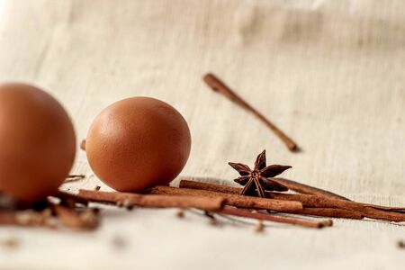 Healthy organic eggs and spice on sackclothの写真素材