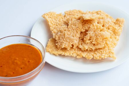 Crispy rice sheets eaten  wiht curryの写真素材