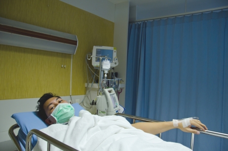 silk boy lay on the bed in the hospitalの写真素材