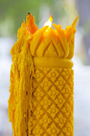 big yellow artistic Thailand candleの写真素材
