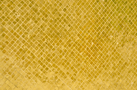 golden mosaic at emerald buddha temple, Bangkok, Thailandの写真素材