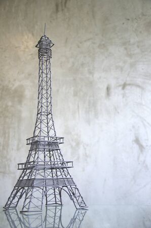 wire Eiffel tower on raw concrete backgroundの写真素材