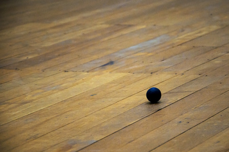 squash ball on the wood floorの写真素材