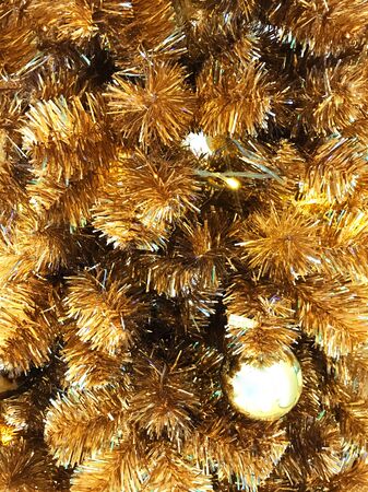 Christmas  tree decorate with golden balls and ornamentsの写真素材