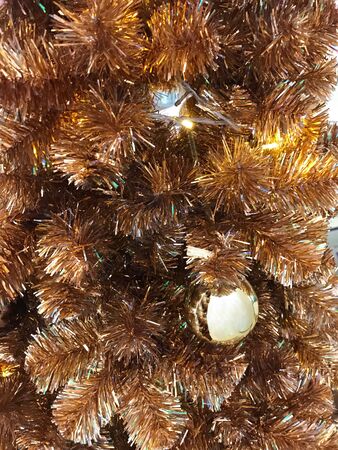 Christmas  tree decorate with golden balls and ornamentsの写真素材