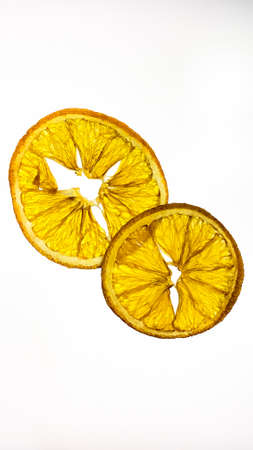 transparent orange slice on white light boxの写真素材