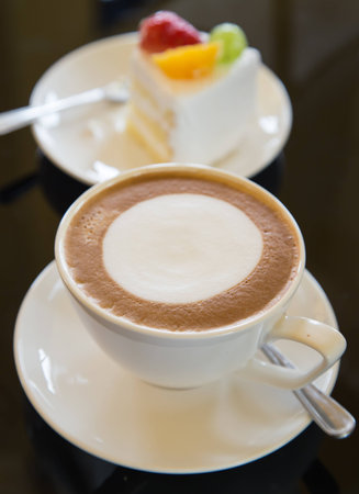 Coffee, cappuccino and cake  Classified as a delicious breakfast or snack の写真素材