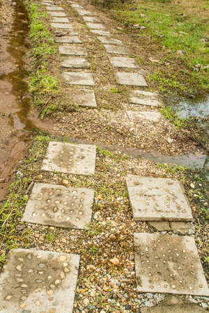 Walk in the park covered with slabsの写真素材