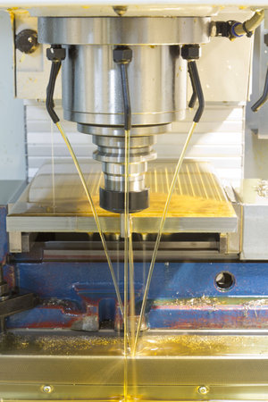 Milling machine CNC drill steel on bench vise oil coolant