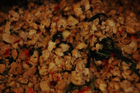 spicy fried pork in oil with holy basil leaves and chilli の写真素材