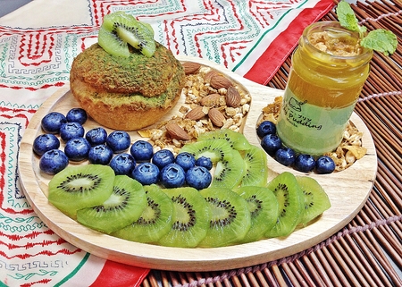 Kiwi fruit and blueberries Chou cream with green tea custard puddingの写真素材