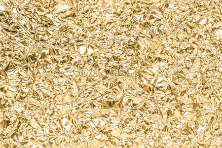Gold wrinkled paper texture abstract background
の写真素材