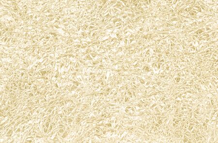 Gold wrinkled paper texture abstract backgroundの写真素材