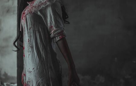 Zombie girl is standing with blood.の写真素材