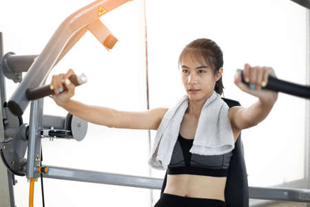 Young fitness woman doing exercise workout at gymの写真素材