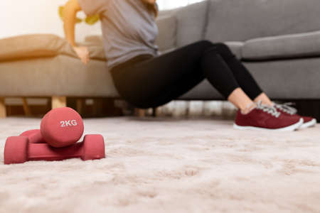 Close up woman exercise workout at home.の写真素材