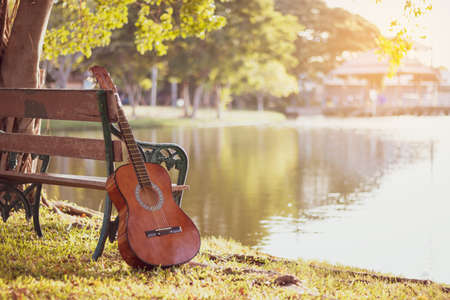View of Acoustic guitar at lake. background the nature of the lake.の写真素材