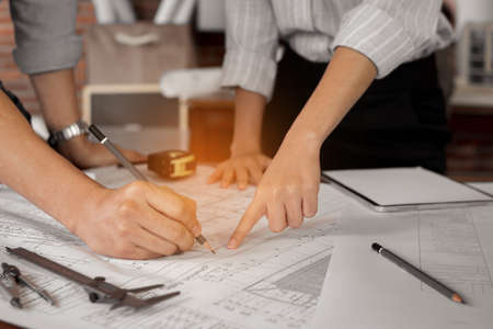 engineers, technician or architect concept. Close up engineer team sketching and drawing house...