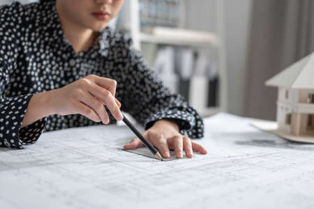 Architect or Engineer hand sketch the drawing construction building.
