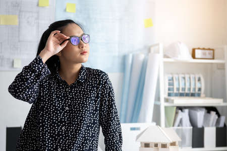 Startup project. Close up of architect woman preparing project.