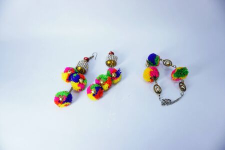 matching colorful ear ring and bracelet in white background