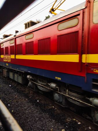 indian railway , red color train on the track