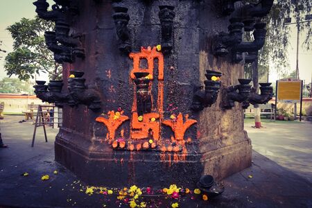 ujjain- m.p.- india- 9 november 2019, holy symbol of hindu goddess in maa harsiddhi temple at ujjain, lower image of the pillar of lampのeditorial素材