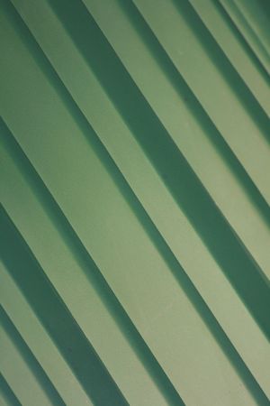 A green background of green diagonal stripes.の写真素材