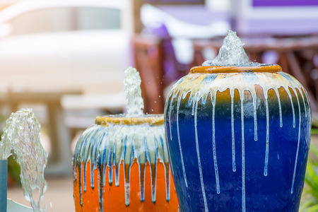 Small  fountain in the park with sunrise.の写真素材