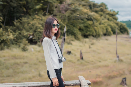 Beautiful young woman portrait wit old camera.の写真素材