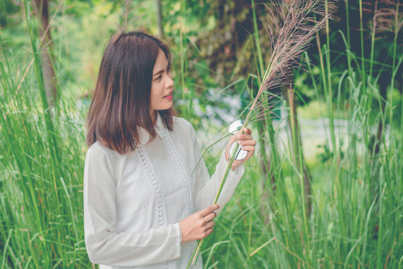 Beautiful young woman portrait wit grass.