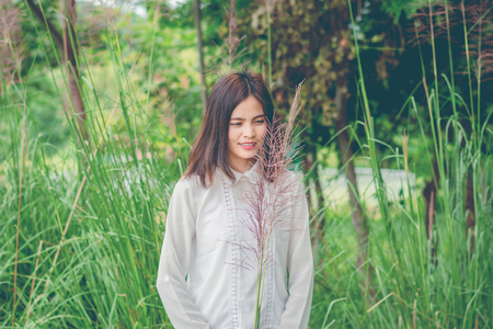 Beautiful young woman portrait wit grass.の写真素材